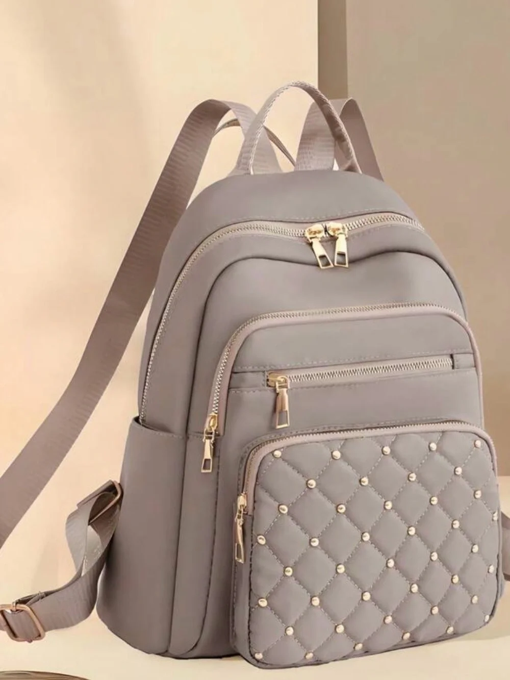 Stylish Quilted Grey Women's Backpack with Gold Hardware